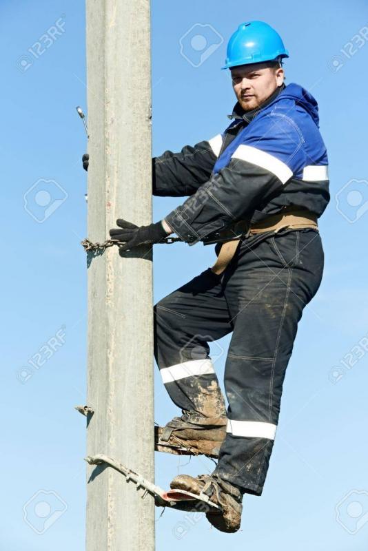 21769724-electrician-lineman-repairman-worker-at-climbing-work-on-electric-post-power-pole.jpg